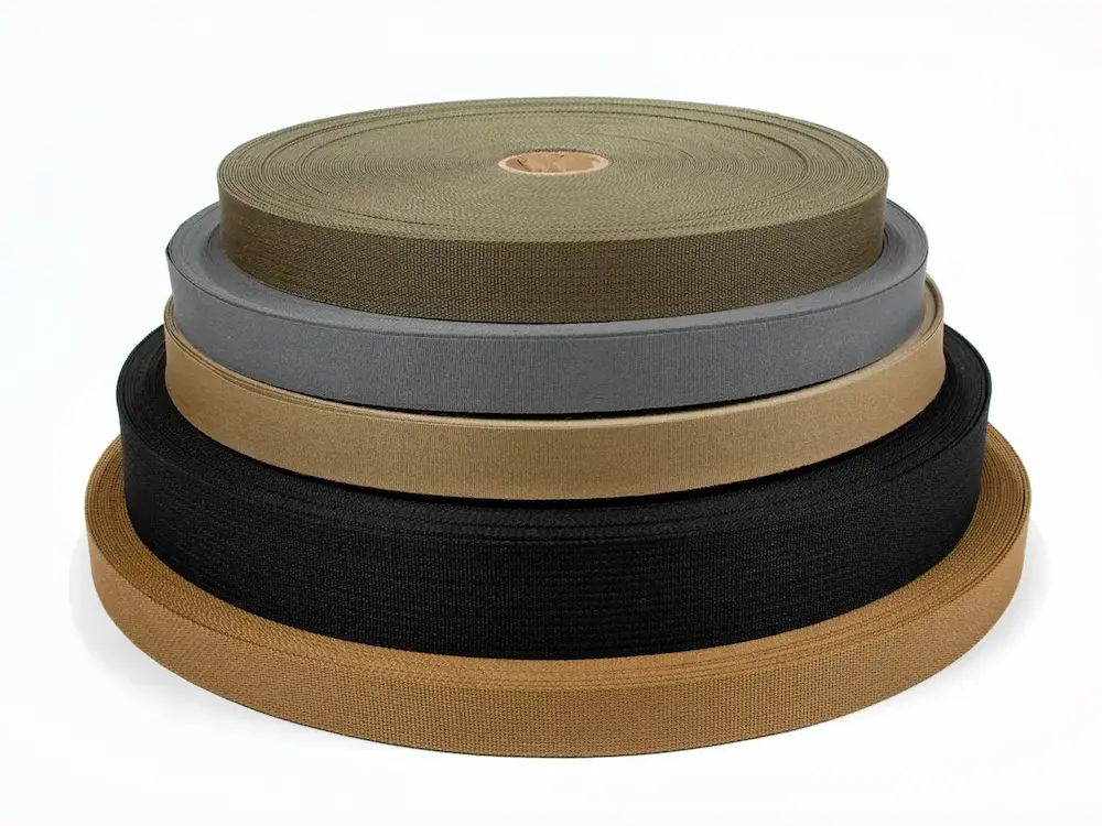 A close-up of various rolls of mil-spec standard webbings.