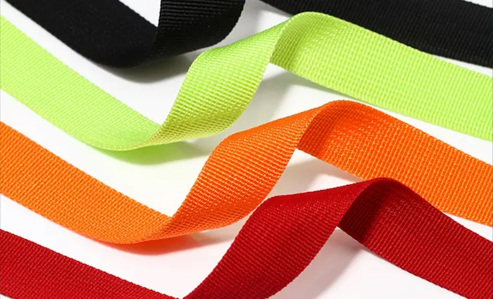 Colorful rolls of polypropylene webbing.
