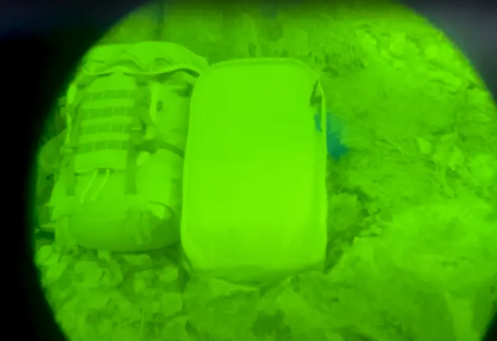 A close-up of IRR military webbing on a MOLLE tactical vest.