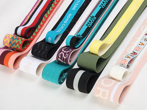 Colorful rolls of custom jacquard elastic webbing.