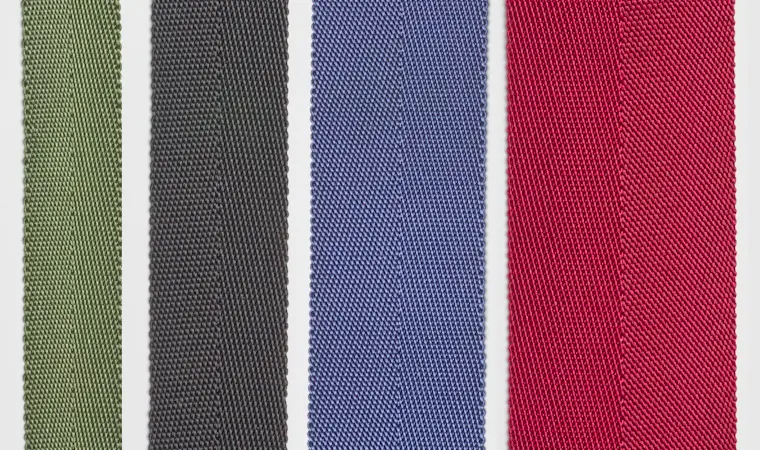 A close-up of heavy-duty MIL-W-4088K nylon parachute webbing showing its thick, robust weave.